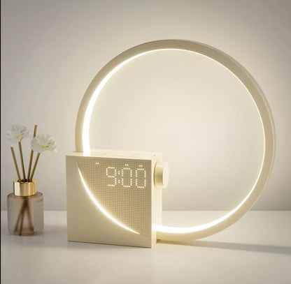 Moon Light Clock with wake-up light and dual alarm features on bedside table