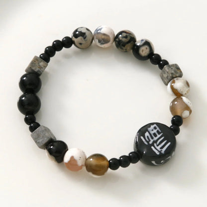 Hand-woven natural black agate ceramic bracelet with geometric design and round elements