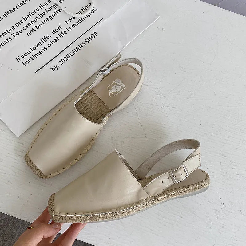 Women's beige retro fisherman flat sandals with animal pattern on canvas upper.