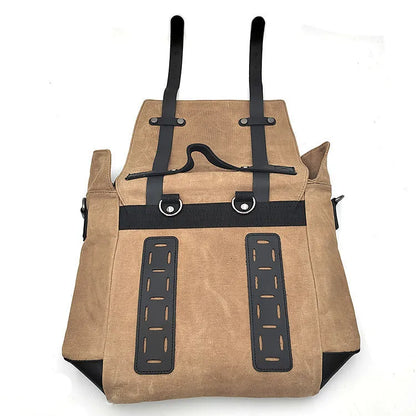 Black waterproof canvas motorcycle side bag with cowhide accents showing mounting straps