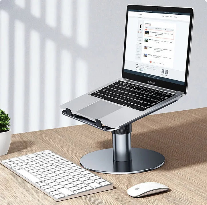 Silver adjustable aluminium car laptop stand with rotating base shown holding a laptop