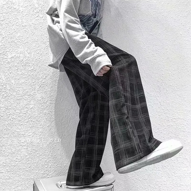 Men's black and green plaid straight leg trousers showing mid-waist design and six size options