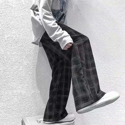 Men's black and green plaid straight leg trousers showing mid-waist design and six size options