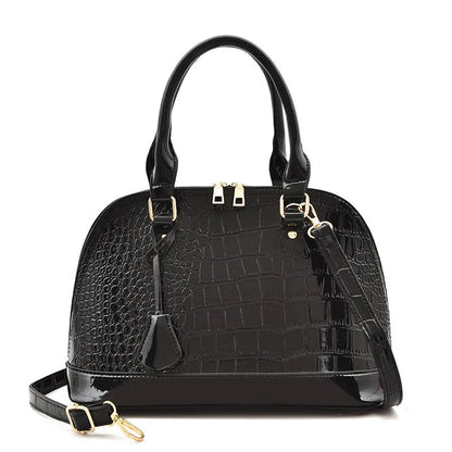Shiny black PU leather crossbody bag with a structured shell shape and a long strap.
