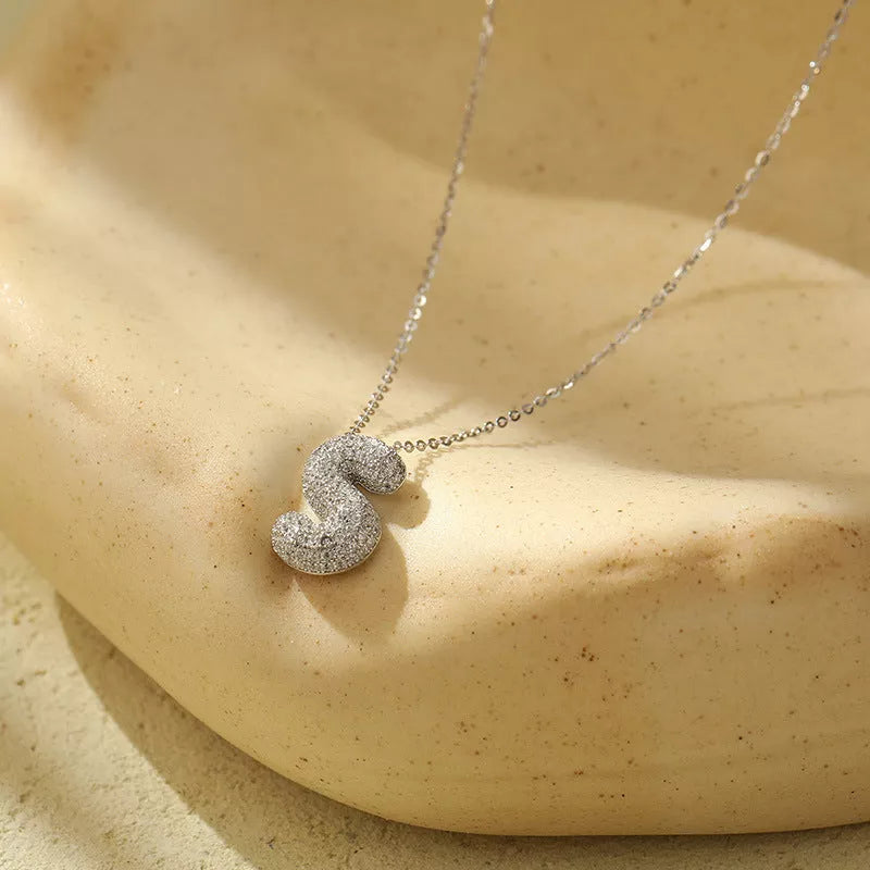 Stainless steel initial pendant necklace with zircon accents, personalized with your choice of letter.