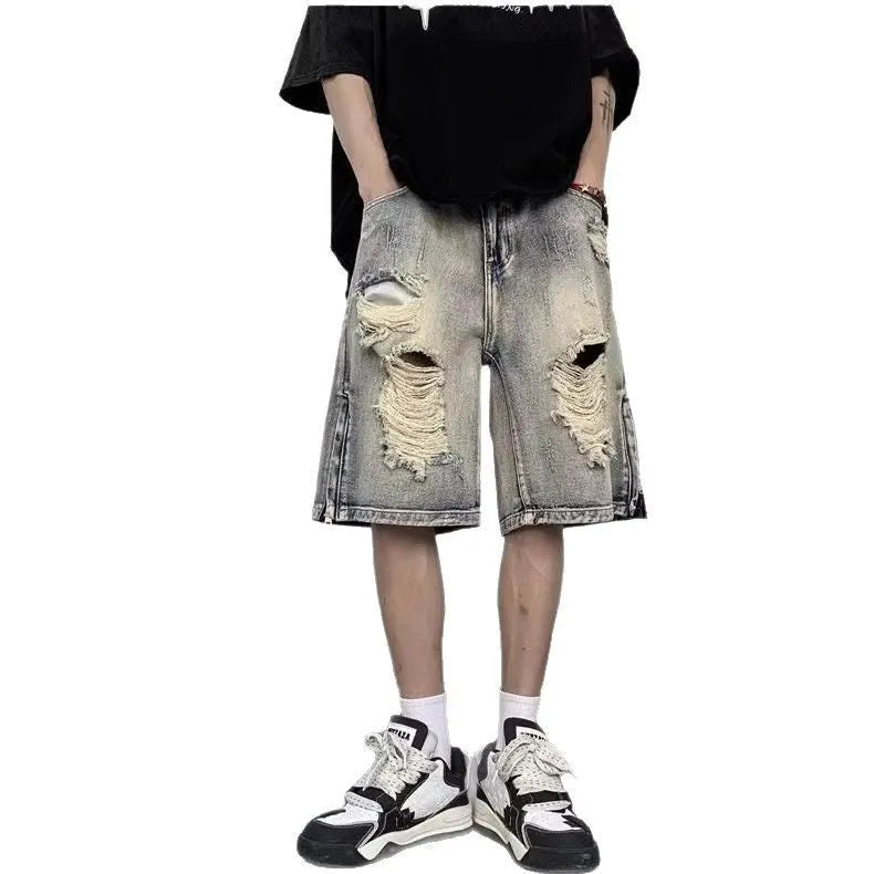 Blue denim shorts with wide-leg cut and tattered retro detailing on mannequin