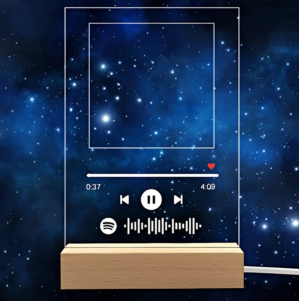 Customisable photo night light with 22x15cm acrylic panel showing engraved song lyrics beside personal photograph