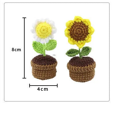 Creative wool potted plant car air vent clip aromatherapy pendant on a car vent.