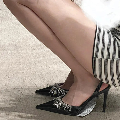 Black women's slingback high heel sandals with pointed toe, 10cm heel, and French tassel rhinestone decoration.