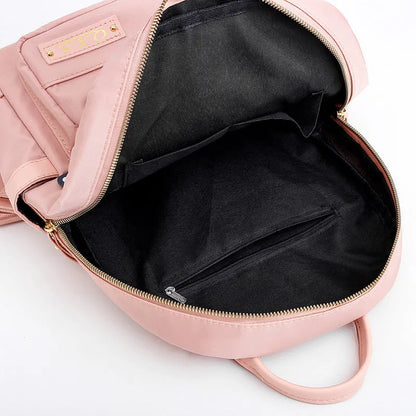 Black square vertical nylon backpack with double shoulder straps showing multiple compartments and anti-theft features