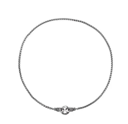 Simple polished S925 sterling silver chain necklace on a dark background, showing its length and clasp.