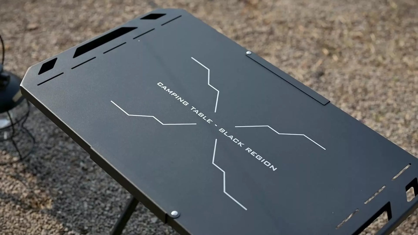 Portable steel camping table with folding design and storage bag, ideal for outdoor adventures