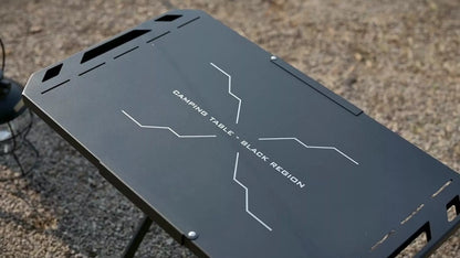 Portable steel camping table with folding design and storage bag, ideal for outdoor adventures