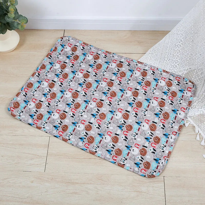 Reusable cloth pet urine pad with animal print and waterproof non-slip backing in various sizes.