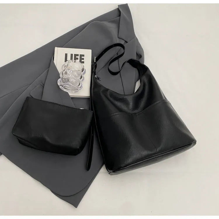 Women's soft PVC bucket shoulder bag with single strap, open pocket, phone pocket, and matching wallet