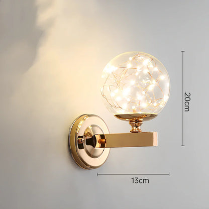 Crystal bedside lamp with stainless steel base and transparent shade providing soft illumination