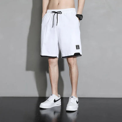 Cotton shorts for teenage boys in black, shown on a hanger, featuring a mid-waist design.
