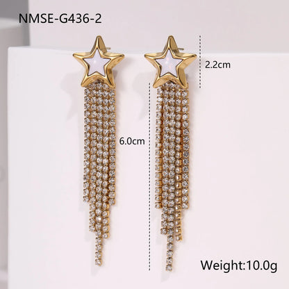 Gold-coloured women's earrings with a love heart shape, star details and dangling diamond-style tassels on a white background.
