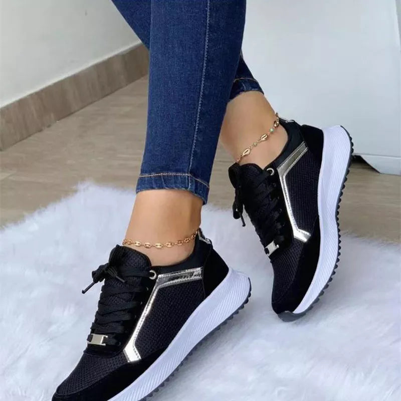 Women's lace-up sports sneakers with breathable mesh upper in black, white, and apricot