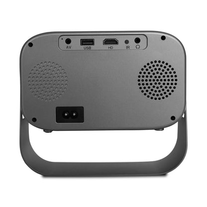 Black HD smart portable projector with remote control and cables on a table