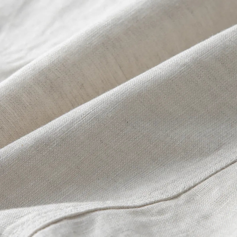 Men's loose fit linen suit jacket in solid colours showing long sleeves and casual styling