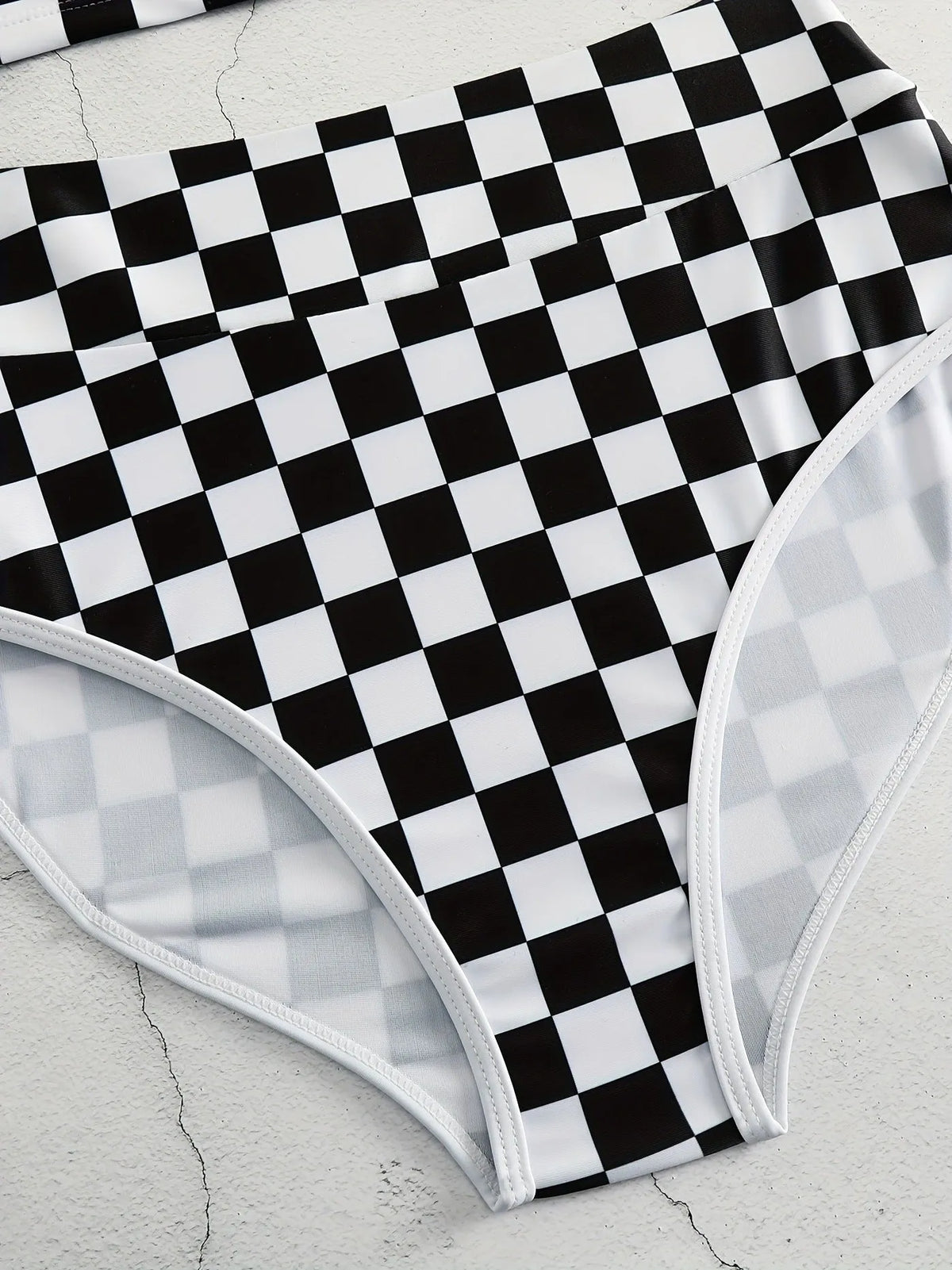 Women's black and white checkerboard print backless racing swimsuit with suspender straps
