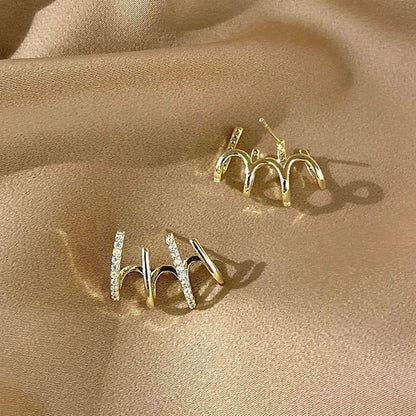 Elegant silver-tone zircon stud earrings with a sleek and sophisticated design