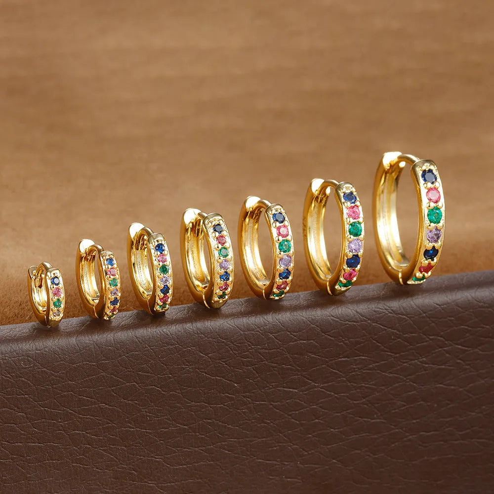 Circle zircon perforated stud earrings in gold, rose gold, silver colours with geometric design and multiple size options