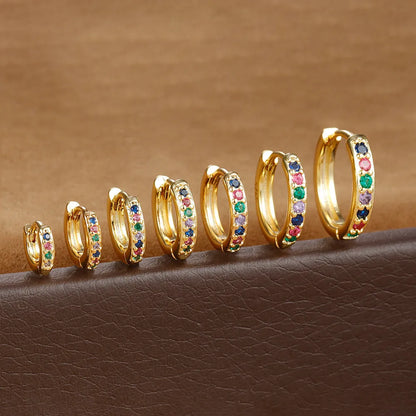 Circle zircon perforated stud earrings in gold, rose gold, silver colours with geometric design and multiple size options