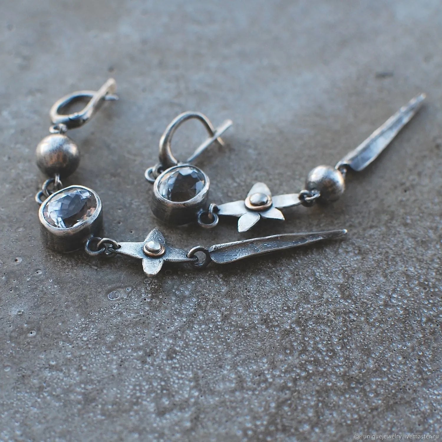 Pair of long antique silver geometric XINGX pendant earrings with rhinestone details on alloy posts.