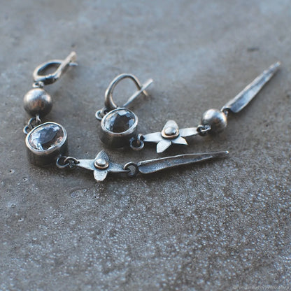 Pair of long antique silver geometric XINGX pendant earrings with rhinestone details on alloy posts.