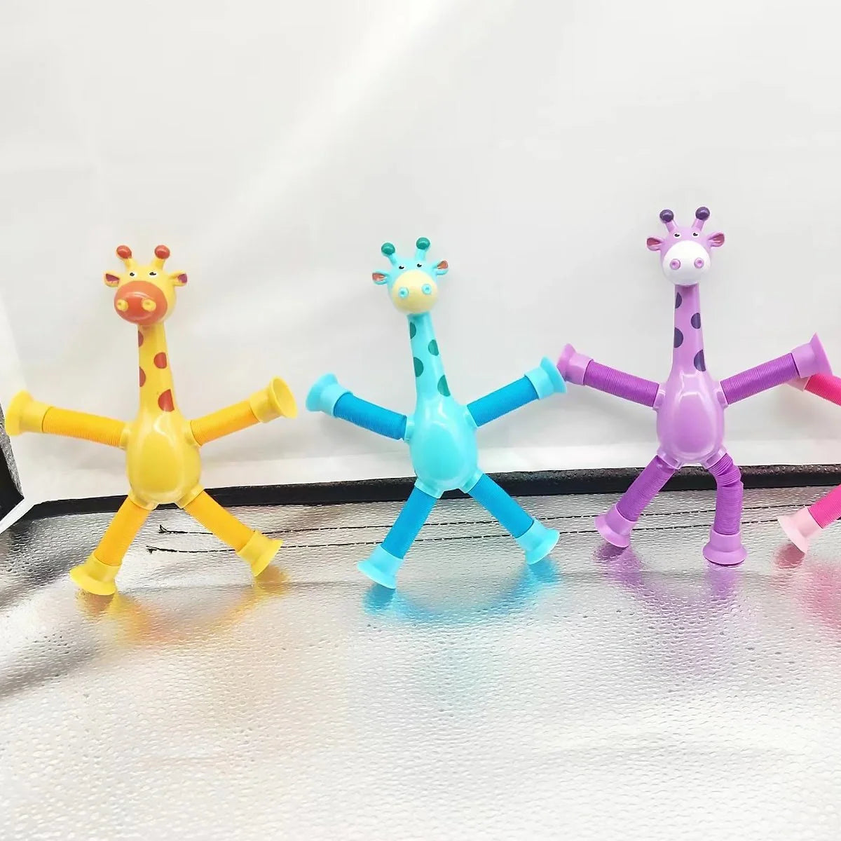 Giraffe Tubes Sensory Toys in various colors, stretchable fidget toy for stress relief