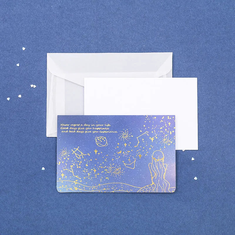 Set of three bronzing detail greeting card envelopes in cosmic colours, showing mermaid style fold.