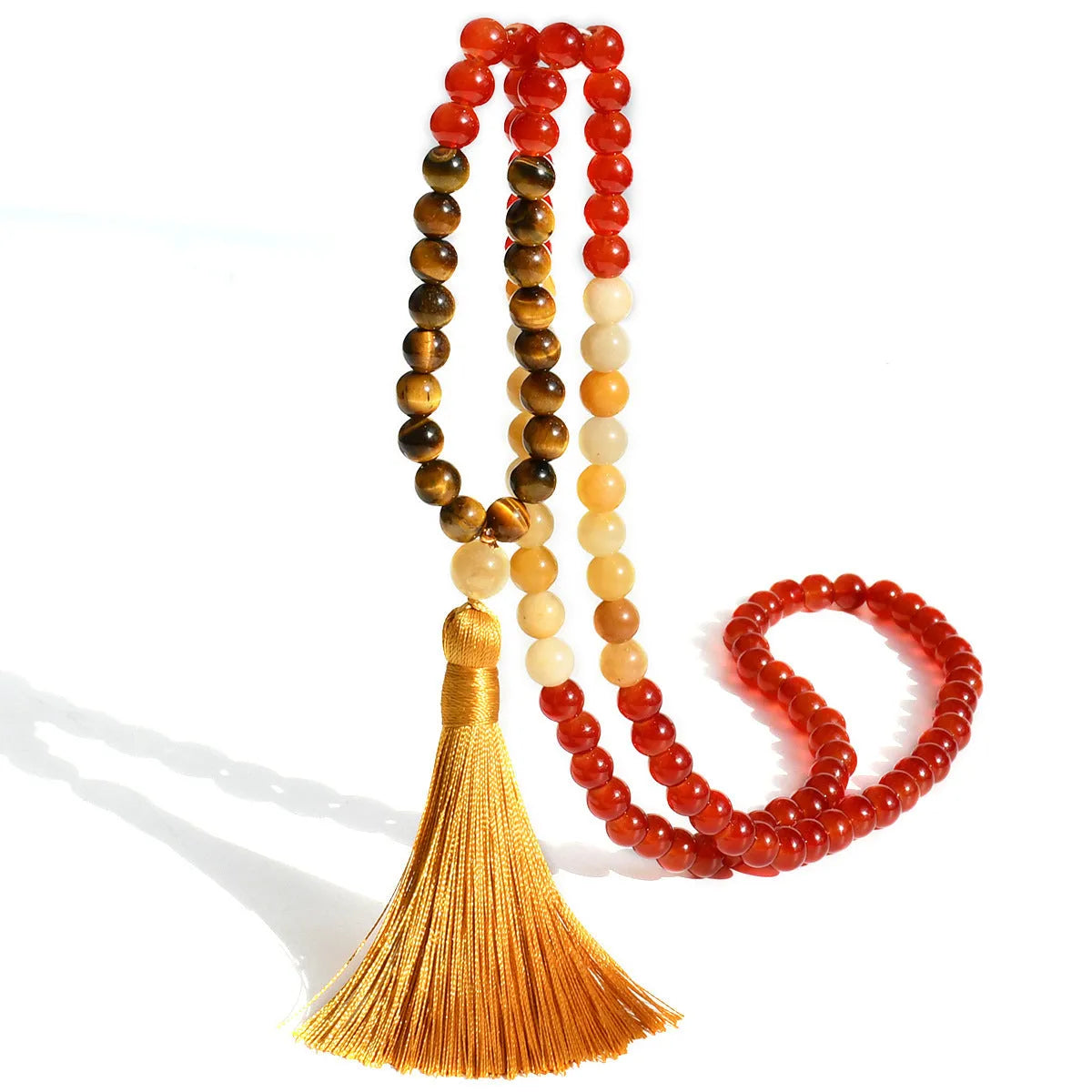 Long beaded necklace with geometric pendant and natural stone tassels in green aventurine.