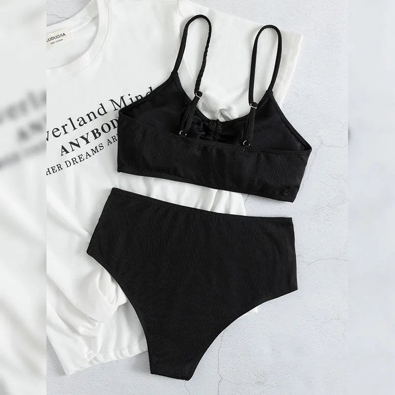 Black women's bikini with high waist and sling split design, shown as a two-piece set.