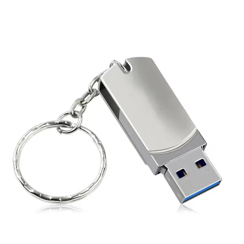 Small white metal USB flash drive with rotation mechanism showing USB connector