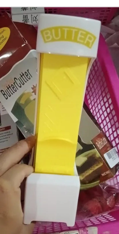 Yellow ABS plastic butter cutter with stainless steel blades for quarter-pound stick butter bars