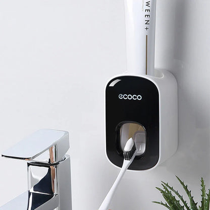 Wall-mounted automatic toothpaste dispenser with toothbrush holder and storage organizer, available in black and grey colors