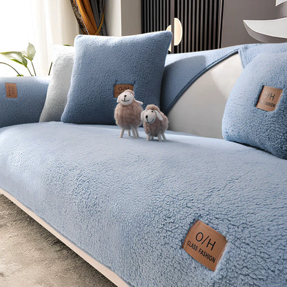 Lambswool sofa cushion with removable 45x45cm cover in solid beige colour on grey sofa