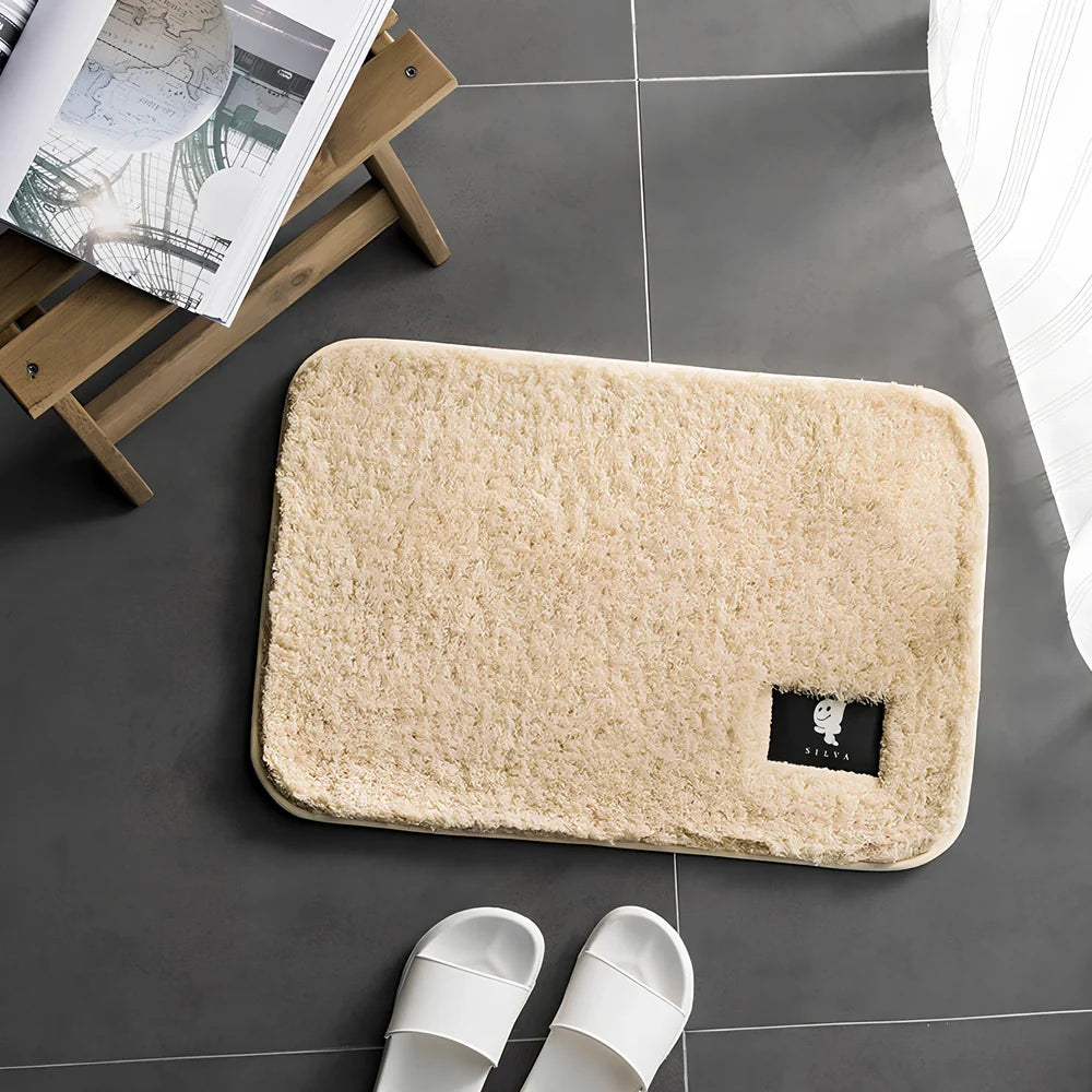 Rectangular polyester anti-slip mat in beige colour for bathroom use with non-woven construction