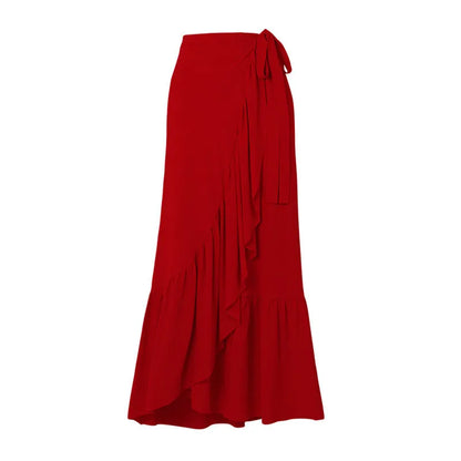 Red one-piece swimsuit with V-neck halter, open back, and a matching long skirt, with a detachable fabric flower.