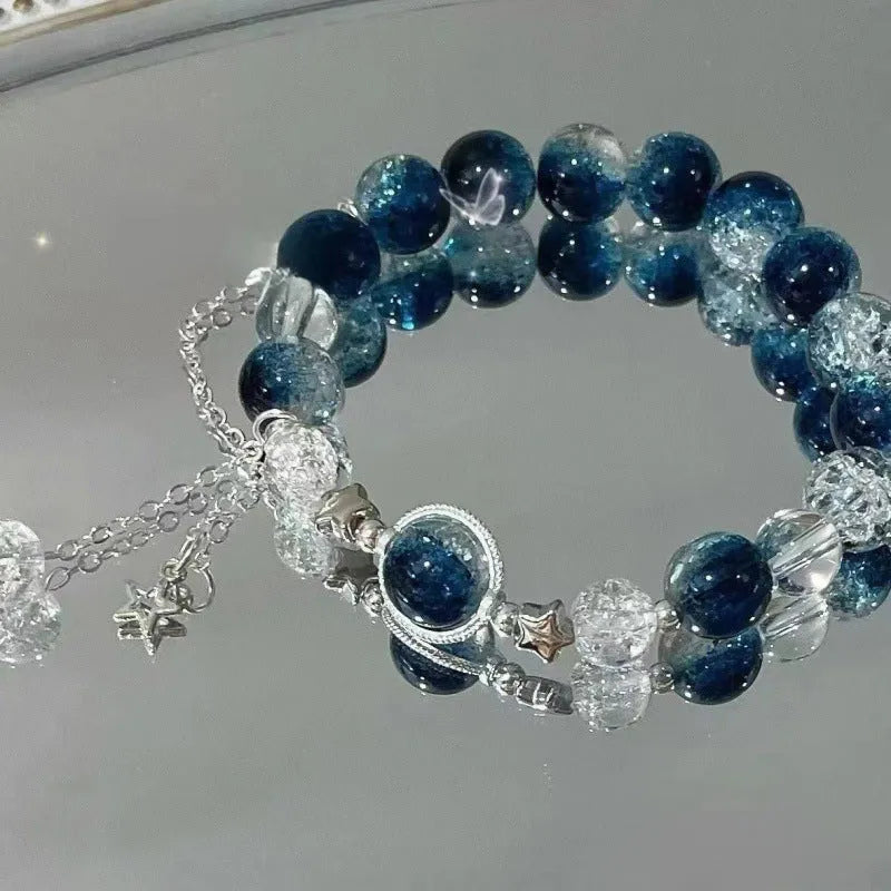 Chinese style glass bead bracelet with bamboo joint design on wrist.