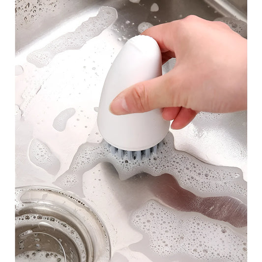 Carrot-shaped kitchen cleaning brush with nylon bristles in orange colour