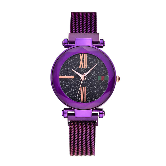 Rose gold ladies watch with round 32mm dial and magnetic stainless steel jewellery clasp on wrist.