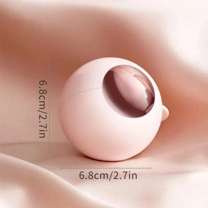 White, pink, green, and deep pink coloured ABS hair removal ball with a handle for pet hair and lint.