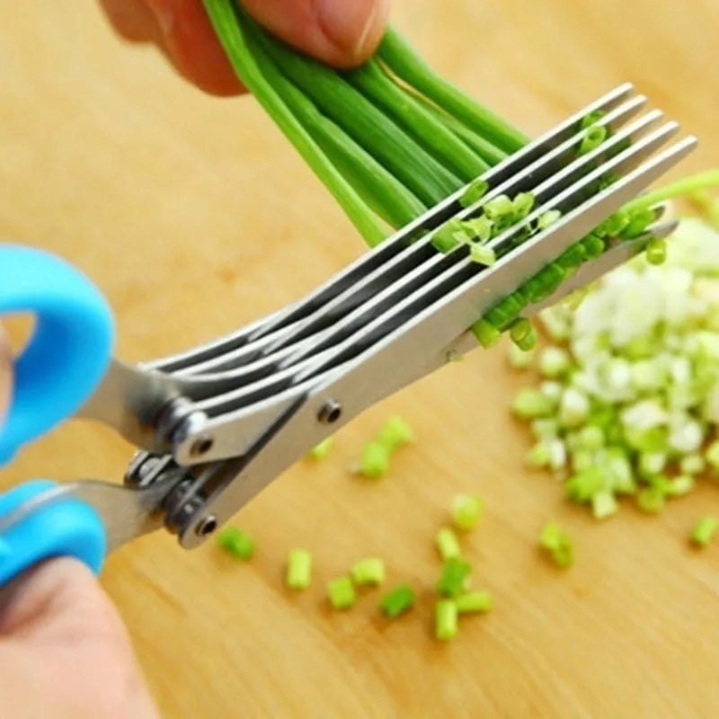 Green stainless steel multi-layer V-shaped kitchen scissors for cutting onions and herbs.