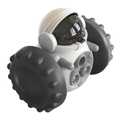 Robot-shaped self-balancing dog treat dispenser toy in green, showing size for small pets