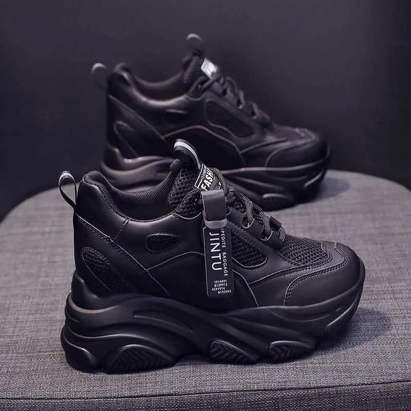 Women's black mesh platform casual shoes with hollow-out design detail on white background