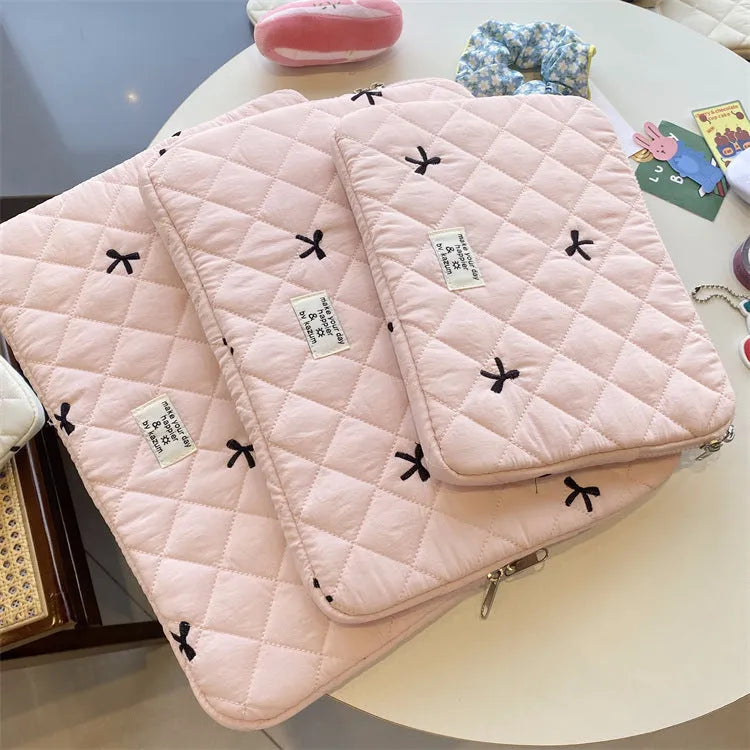 Nylon notebook storage bag with rhombus embroidery and bow, shown in light blue colour.