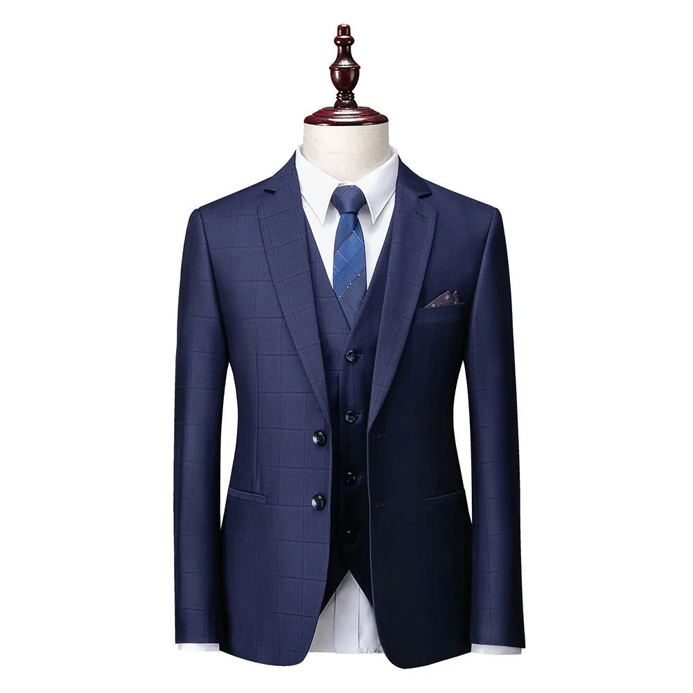 Men's navy blue slim fit three-piece suit with waistcoat on a hanger